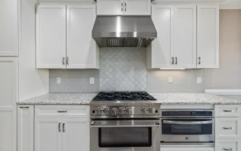 Stainless steel oven built into a modern kitchen
