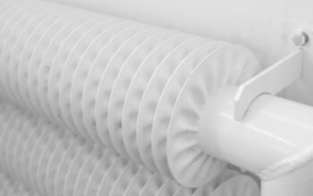 White radiator mounted on wall in a UK home