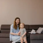 Parent and child in a childproofed living room