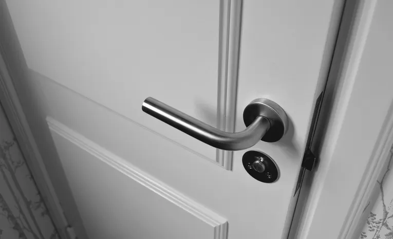 White wooden interior door slightly ajar