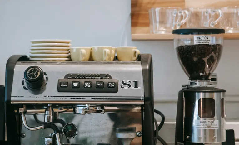 Espresso machine and grinder on a kitchen countertop